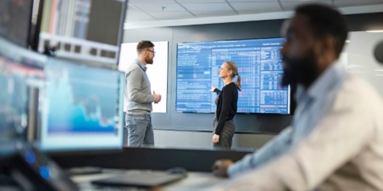 People in office working with trading